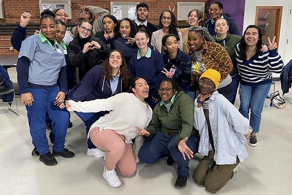 A group of Professor Tiyi Morris' students smile and pose from her Spring 2022 Course AAAS 3083: "The Civil Rights and Black Power Movements," at the Ohio Reformatory for Women.