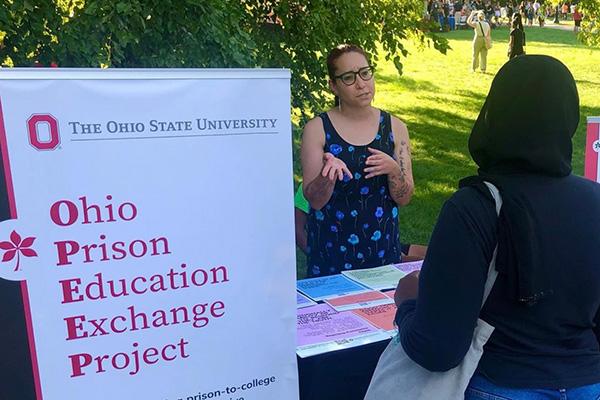 OPEEP Program Coordinator Babette Cieskowski speaks with a student at the Columbus campus student involvement fair.