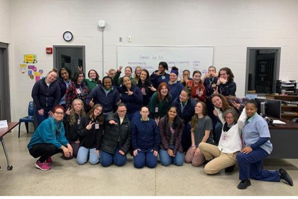 Students from Dr. Mary Thomas' Autumn 2022 WGSS 1110H class pose for a "silly" group photo during their final class meeting at the Ohio Reformatory for Women.