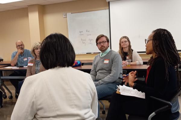 Discussion amongst participants in a "fishbowl" classroom exercise during OPEEP's May 2023 Instructor Training.