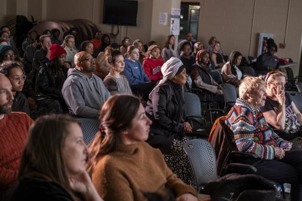 Members of the audience look onward during OPEEP's BackWall performance event on 1/31/2024.