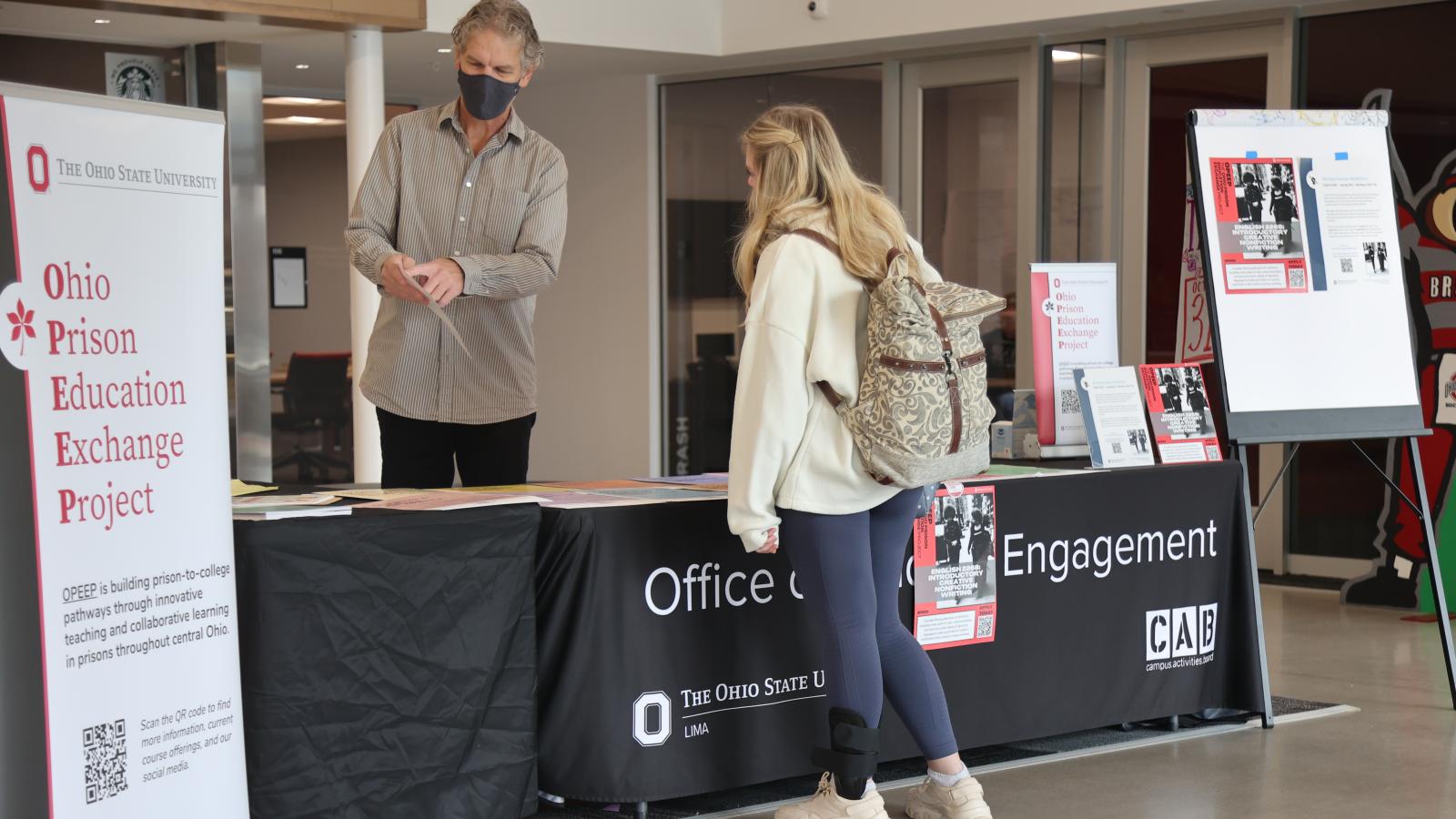 Lima Professor David Adams speaks with a student about OPEEP.