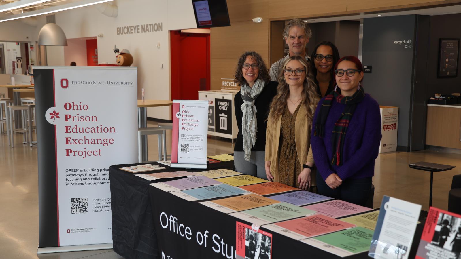 OPEEP Co-Directors and staff pose for a photo with Lima Professor David Adams while tabling at the OSU Lima student center.
