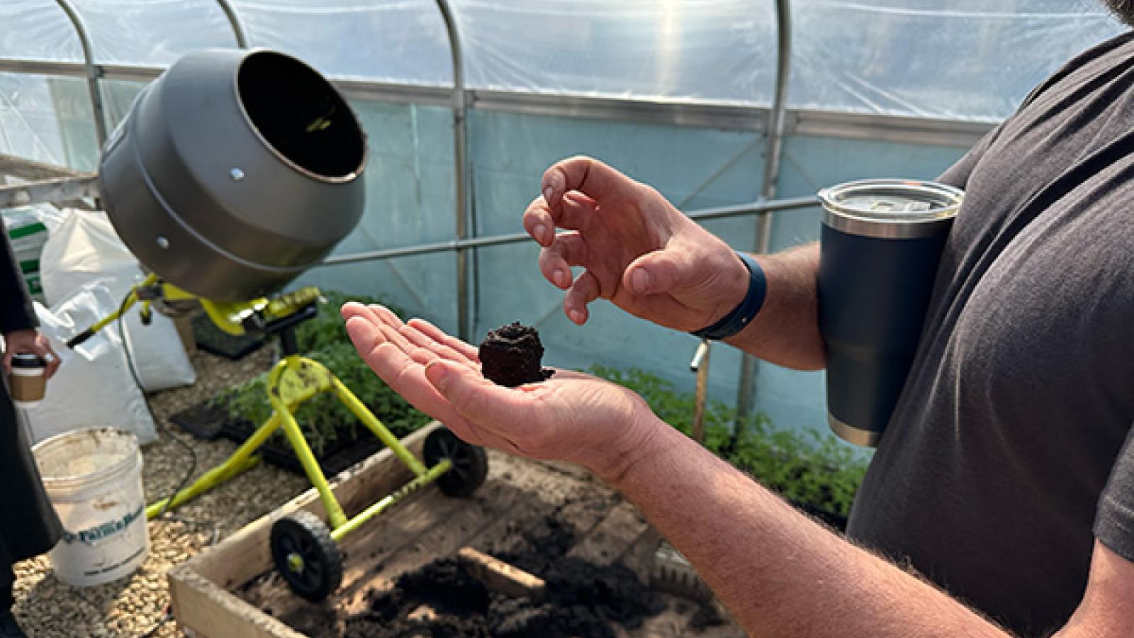 Mansfield Urban Farmer Daniel explaing soil process